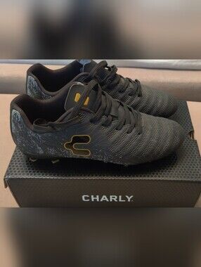 Boys Black Soccer Cleats with Yellow Accent